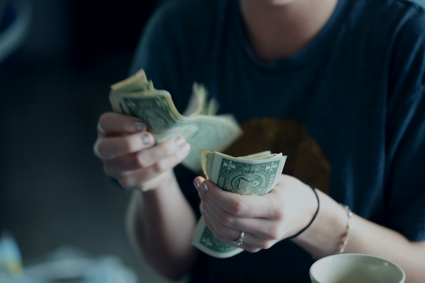 Checking account papers and a mobile phone on a desk