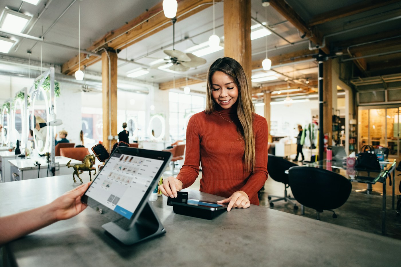A close view of payment processing at a counter