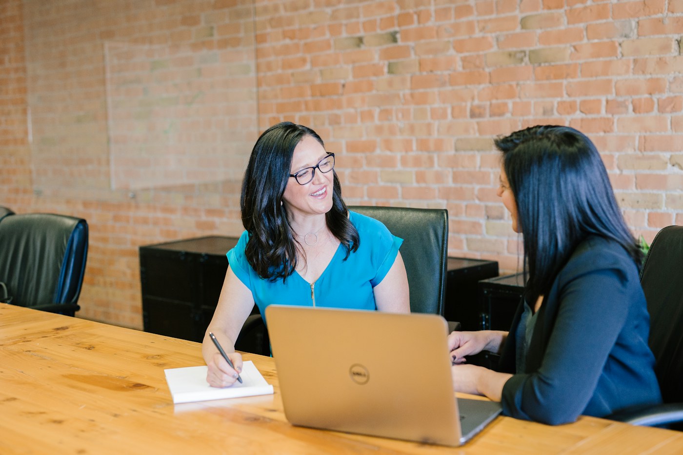A small team collaborating around a meeting table