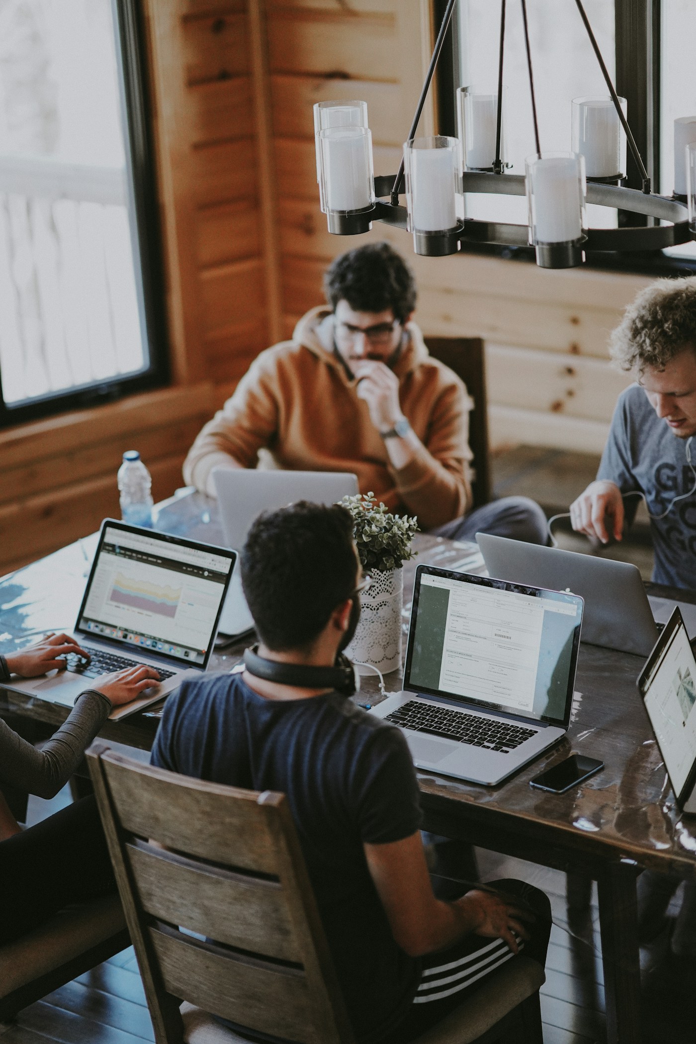 Colleagues planning work around a table
