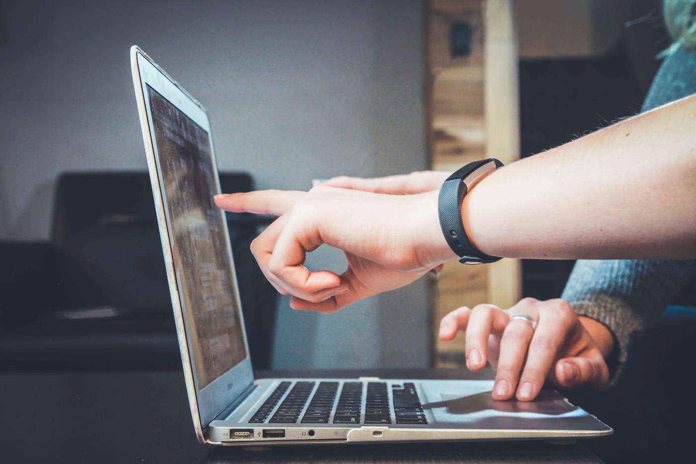 A person working online from a laptop