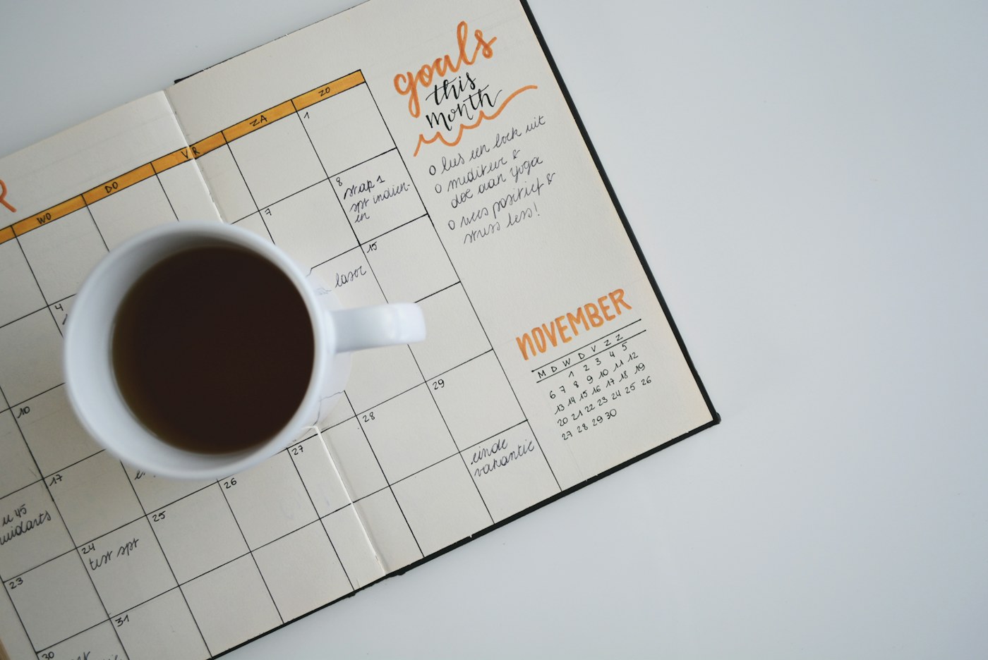 An open planner and pen ready for a budget review